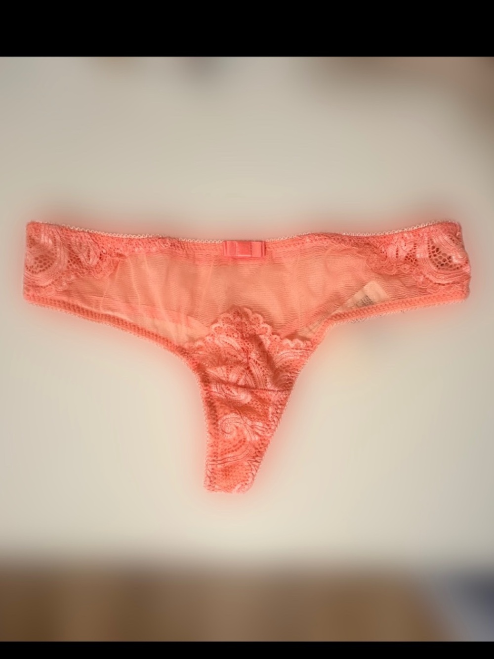Jasmine ,a prominent lingerie brand, coral-colored thong. Size S